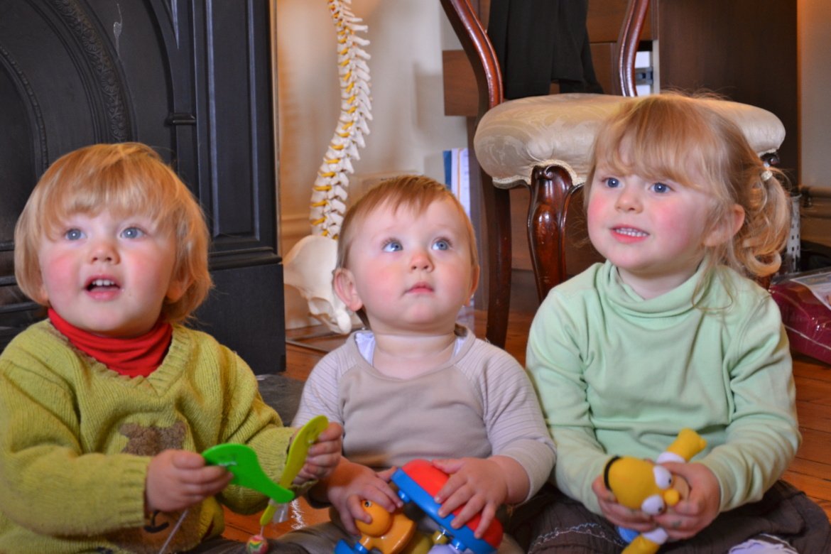 3_young_children_sitting
